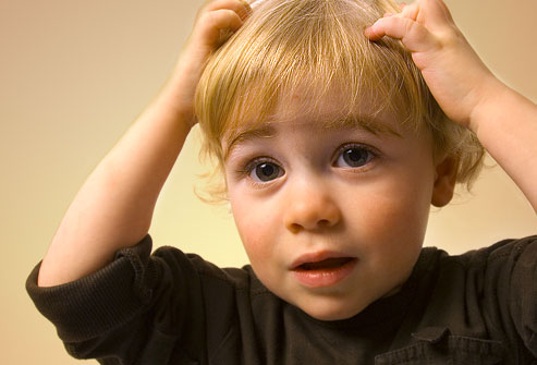 photolibrary_rm_photo_of_boy_scratching_head